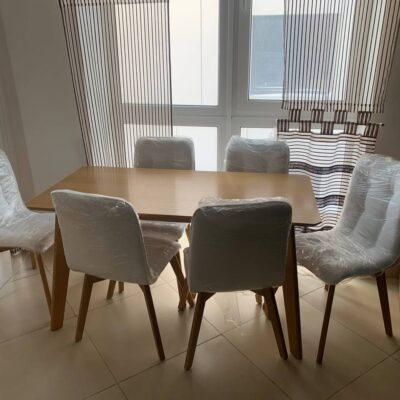 "Modern" table on turned legs complete with soft chairs